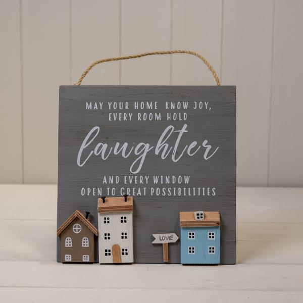 White Wooden Home Sign 'Family Makes Our House A Home' With Grey White and Brown Stand Out Houses